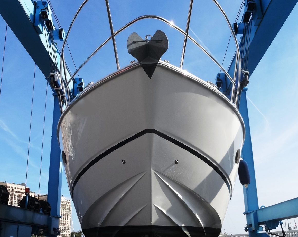 Melbourne Marine Surveyor inspecting vessel on a lift. Early Morning boat inspection in florida.