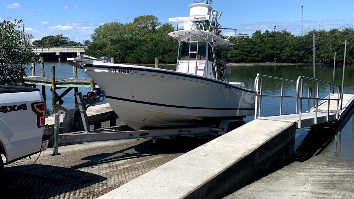 marine surveyor at new smyrna boat ramp for haul out