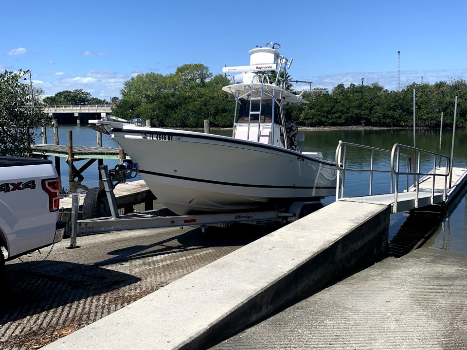 marine surveyor at new smyrna boat ramp for haul out