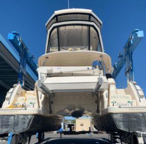 White 2017 Aquila 44 Catamaran Aft View - Out of Water on Travel Lift During Haul Out For Marine Survey at Marine Max in St Petersburg Florida